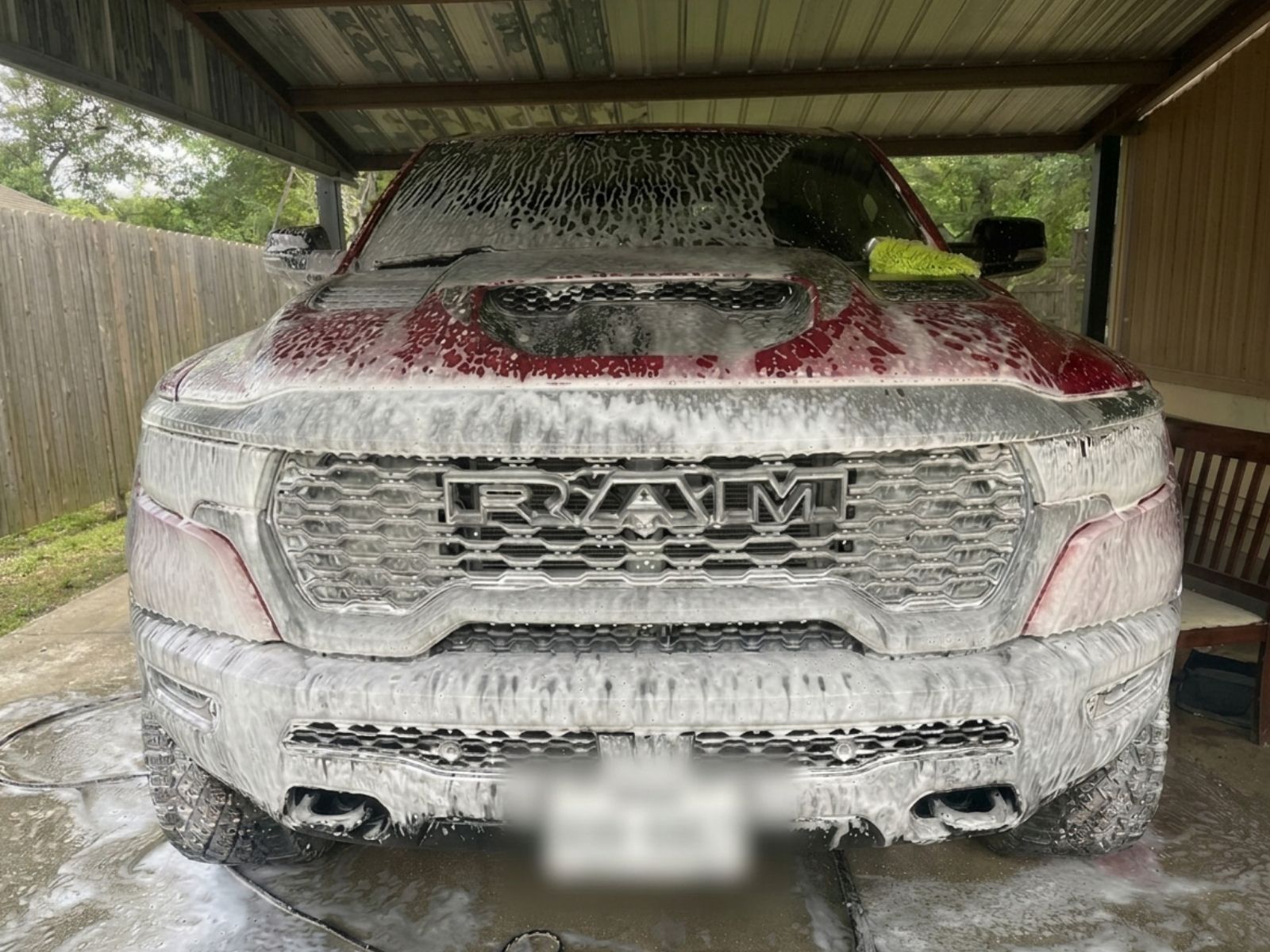 Foam wash on red Ram truck during mobile detailing service