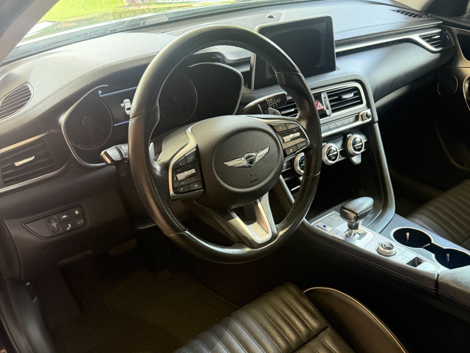 Clean black vehicle interior after detailing service