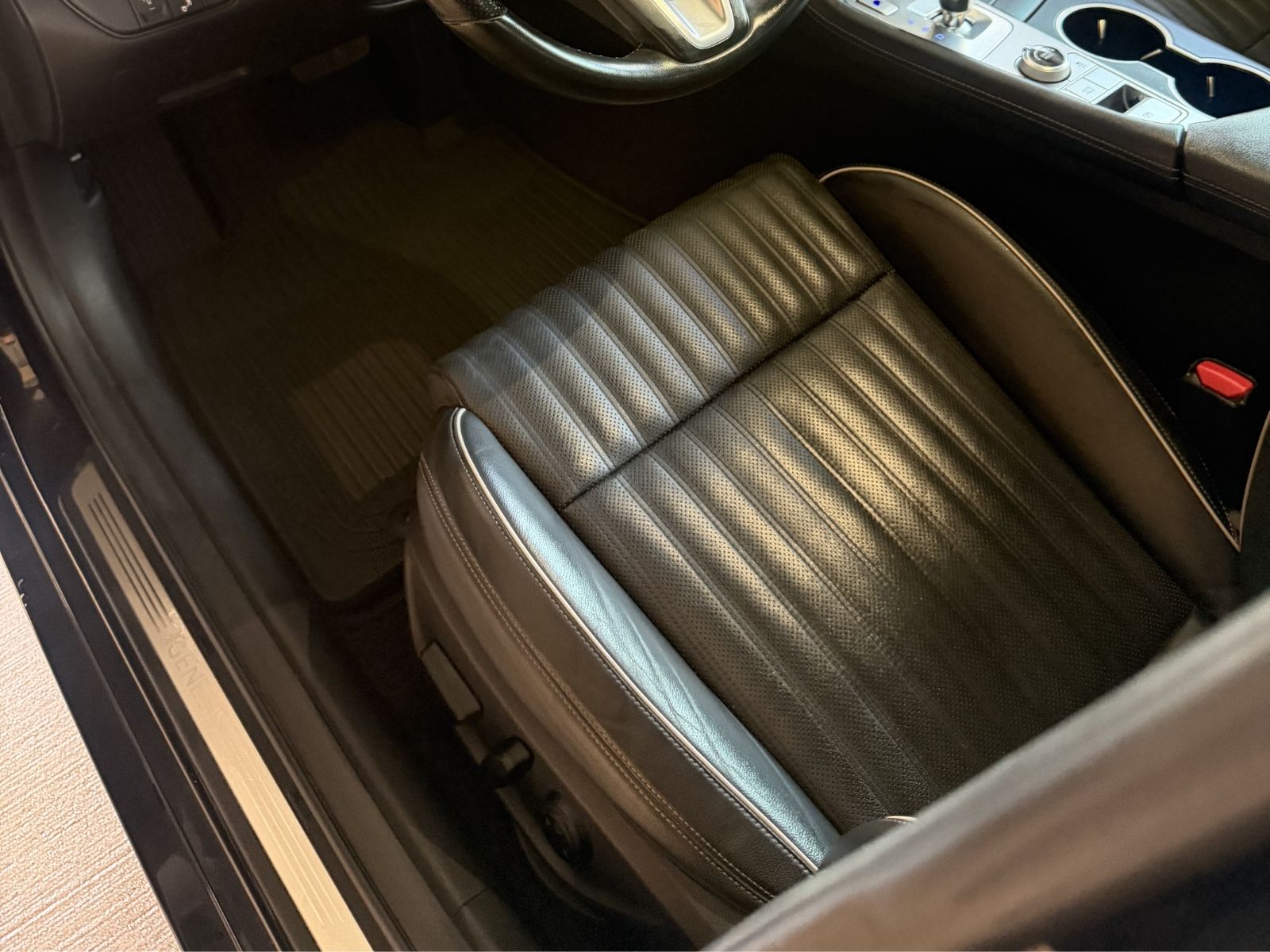 Clean black vehicle interior after detailing service