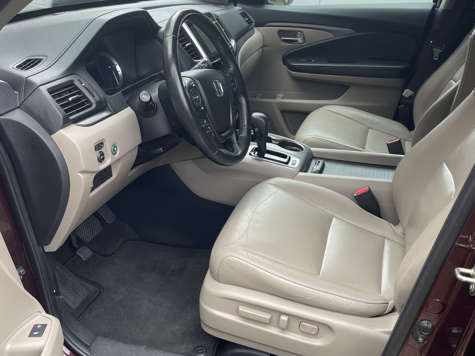 Clean beige vehicle interior after detailing service